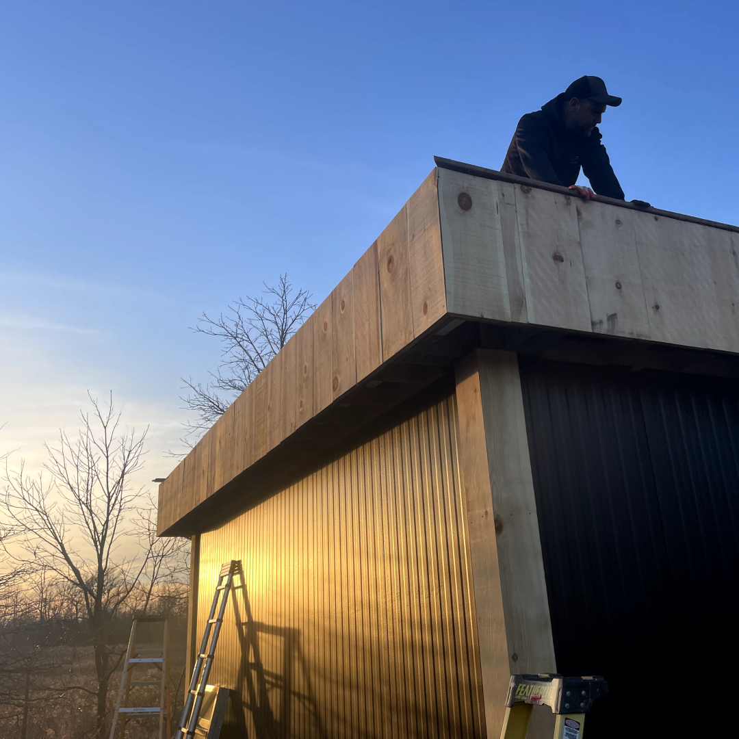 Buildlite team installing insulated metal panel roof